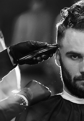 Men's precision haircut in progress with clippers at The Crown Hair Studio Orlando