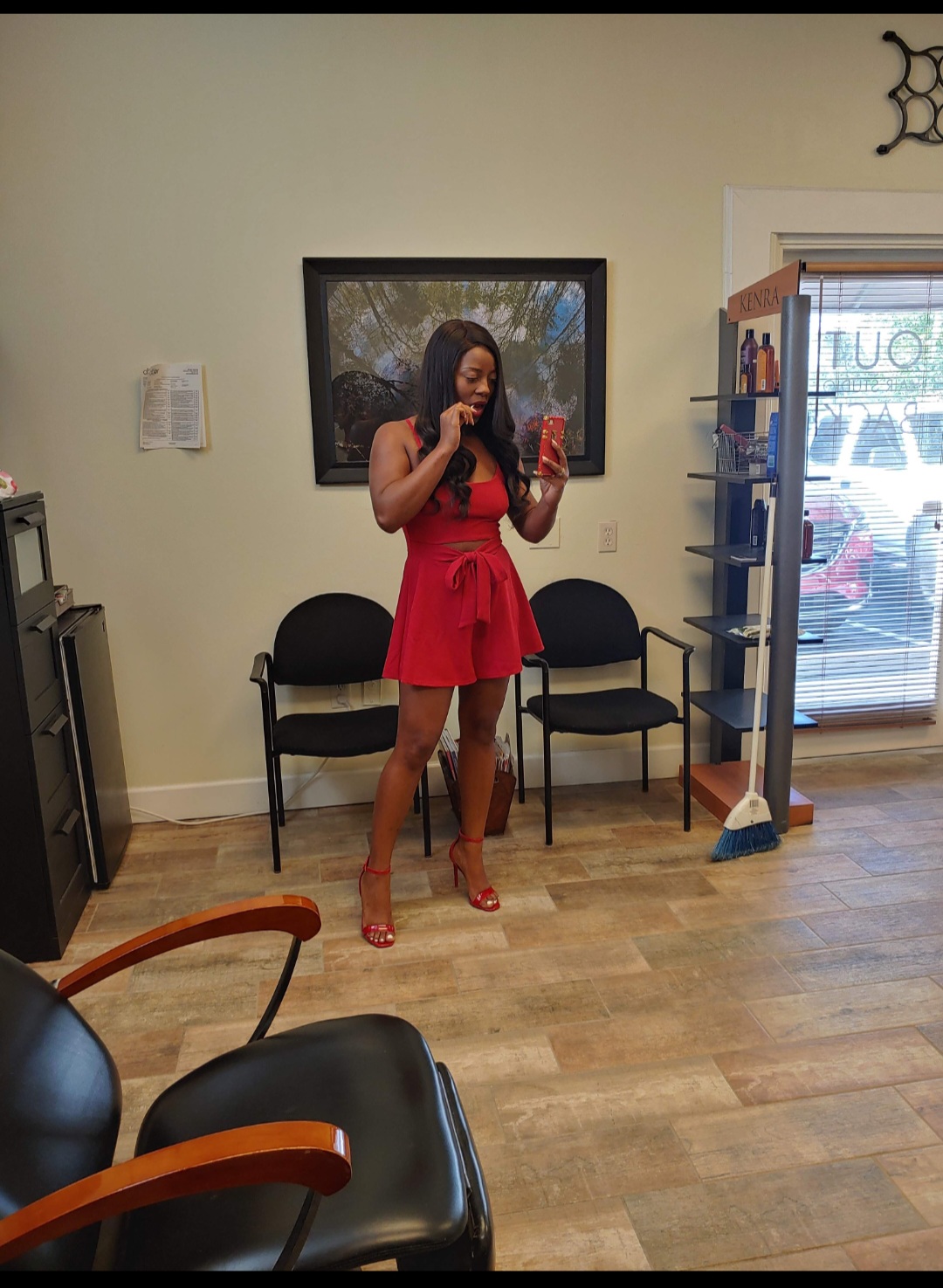 Client posing inside The Crown Hair Studio salon in Orlando FL