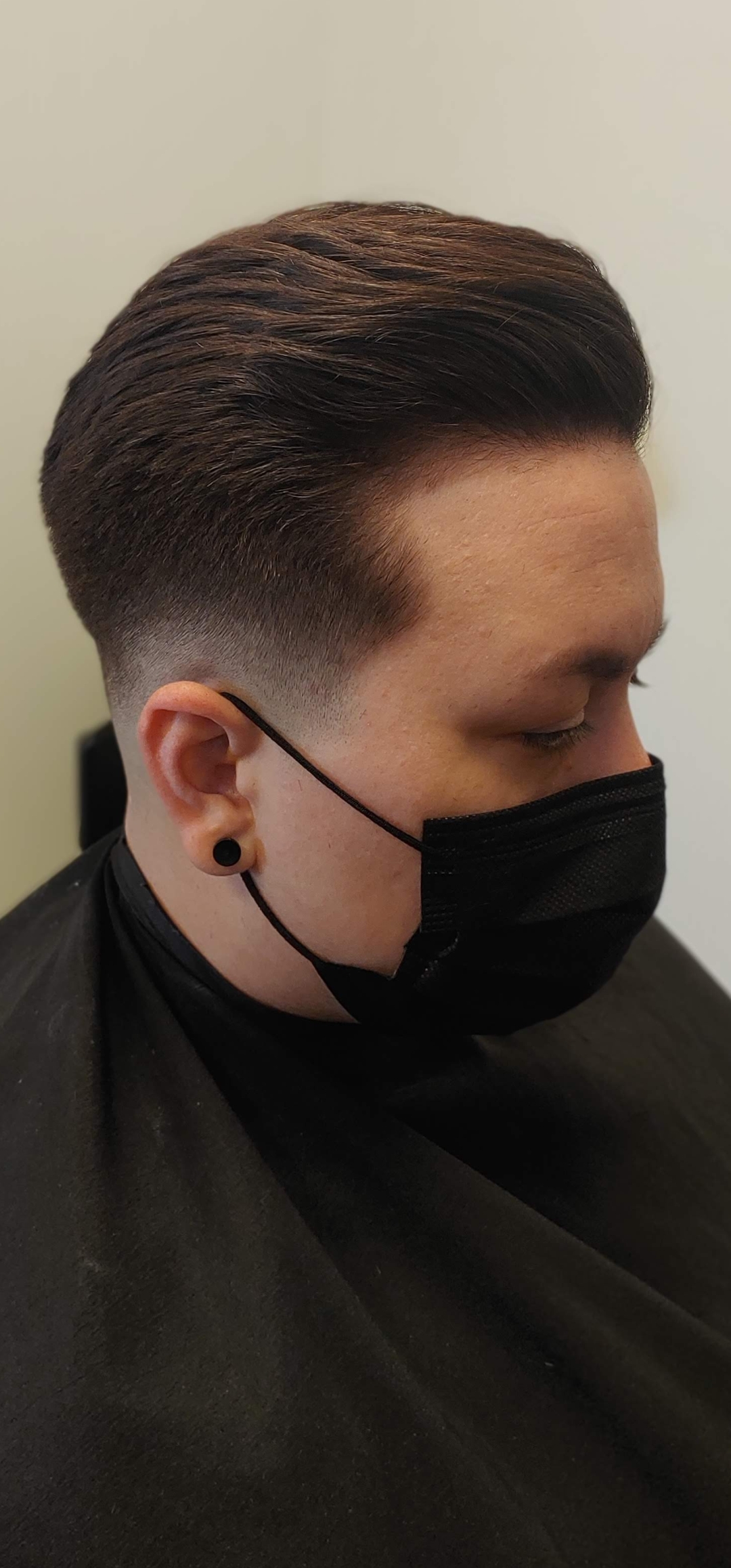 Men's taper fade haircut clean side profile at The Crown Hair Studio Orlando