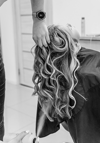 Women's curly hair styling and blowout at The Crown Hair Studio Orlando